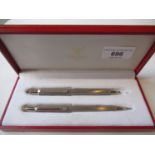 Must de Cartier Paris boxed stainless steel ballpoint pen and pencil set