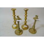 Pair of 19th Century bronze turned column candlesticks together with a pair of brass candlesticks