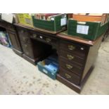 Late 19th / early 20th Century mahogany twin pedestal desk, the green leather inset top above nine