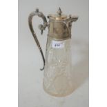 Late 19th / early 20th Century cut glass claret jug with silver plated mask head mounts and scroll