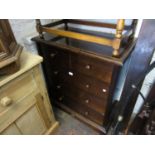 Reproduction mahogany straight front chest of four long drawers on a plinth base