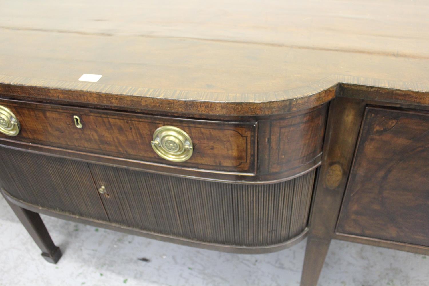 George III mahogany semi bow front sideboard, the crossbanded top above drawers and tambour doors on - Image 2 of 2