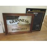 Guinness advertising mirror in a stained pine frame, 20ins x 26ins, together with a Guinness menu