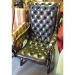 20th Century mahogany brown leather button upholstered slay open arm chair on shaped supports with