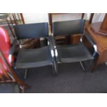 Pair of black leather and chrome open arm chairs This is real leather