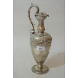 Victorian Scottish silver claret jug with scroll form handle and floral chased decoration, Edinburgh