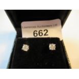Pair of 18ct white gold diamond solitaire ear studs, approximately 0.65ct total