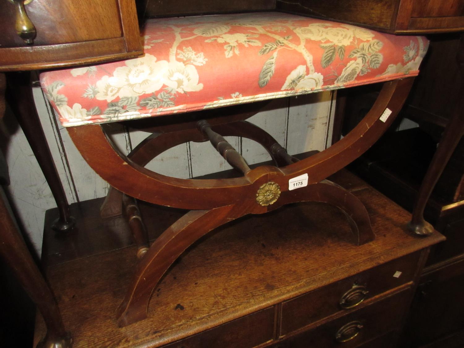 20th Century X-frame stool with overstuffed floral seat, turned stretchers and gilt metal mounts,