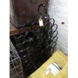 Black painted wrought iron wine rack decorated with grape vines