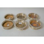 Three pairs of 19th Century plated on copper bottle coasters with turned wooden bases and gadroon