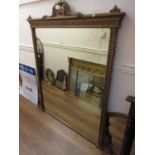 Large 19th Century gilded composition overmantel mirror with an urn and swag surmount and swag