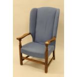 Early 20th Century oak and blue upholstered wing back elbow chair