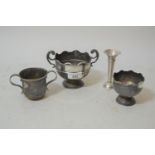 Two silver trophy cups, silver two handled Christening cup and a small silver vase