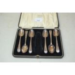 Set of six George III silver teaspoons with engraved decoration in a later case