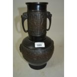 Japanese dark patinated bronze vase with cylindrical neck above a baluster form body decorated