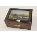 19th Century rosewood work box, the hinged cover inset with a reverse painted glass picture of the