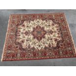 Machine woven carpet of Persian design with red ground and borders, 14ft x 10ft approximately