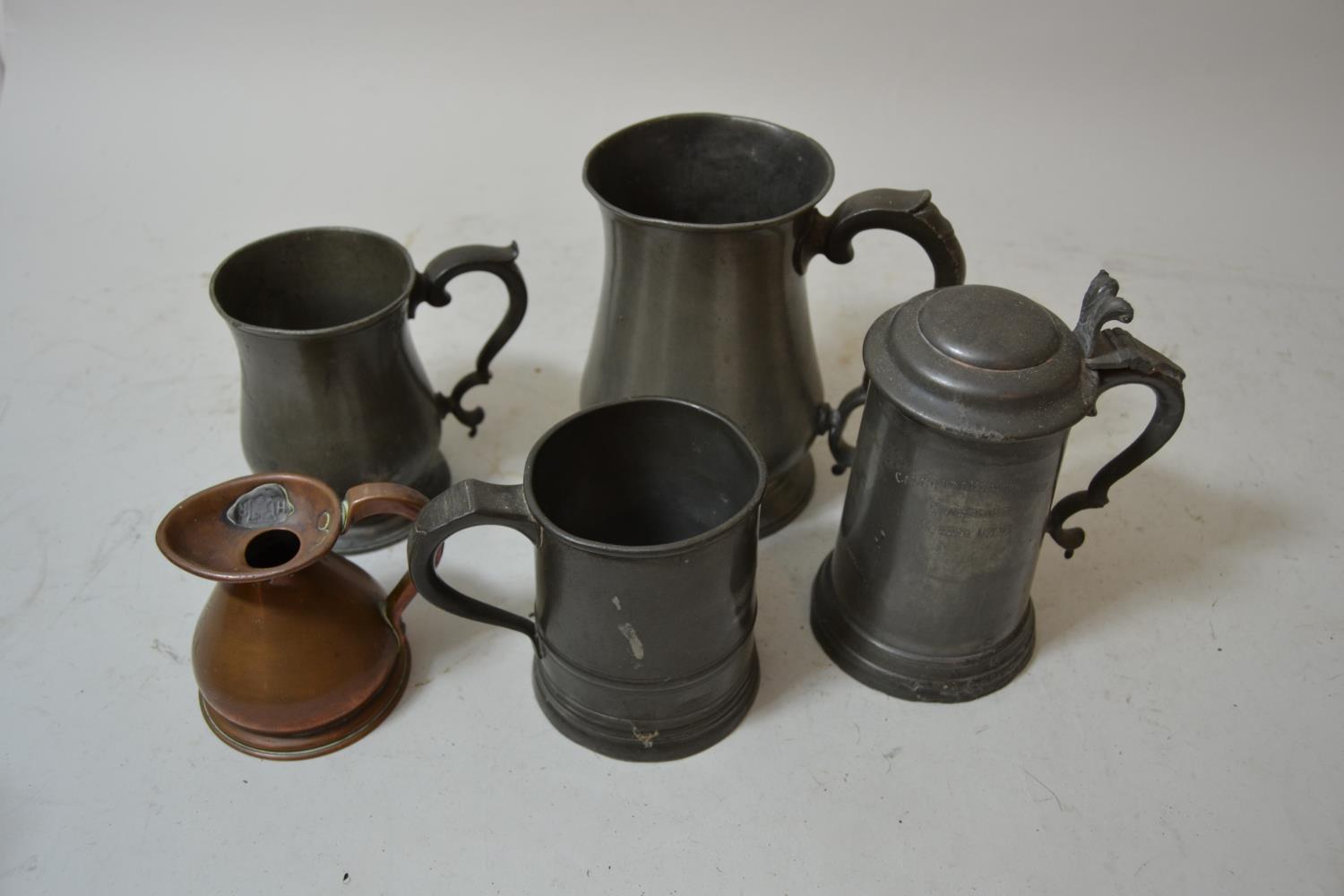 19th Century pewter quart baluster mug with scroll handle, two other pewter mugs, pewter tankard and