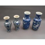 Pair of 19th Century blue and white prunus blossom decorated baluster form vases, 11.75ins high,