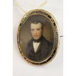 19th Century watercolour portrait miniature of a gentleman wearing a bow tie, in a yellow metal