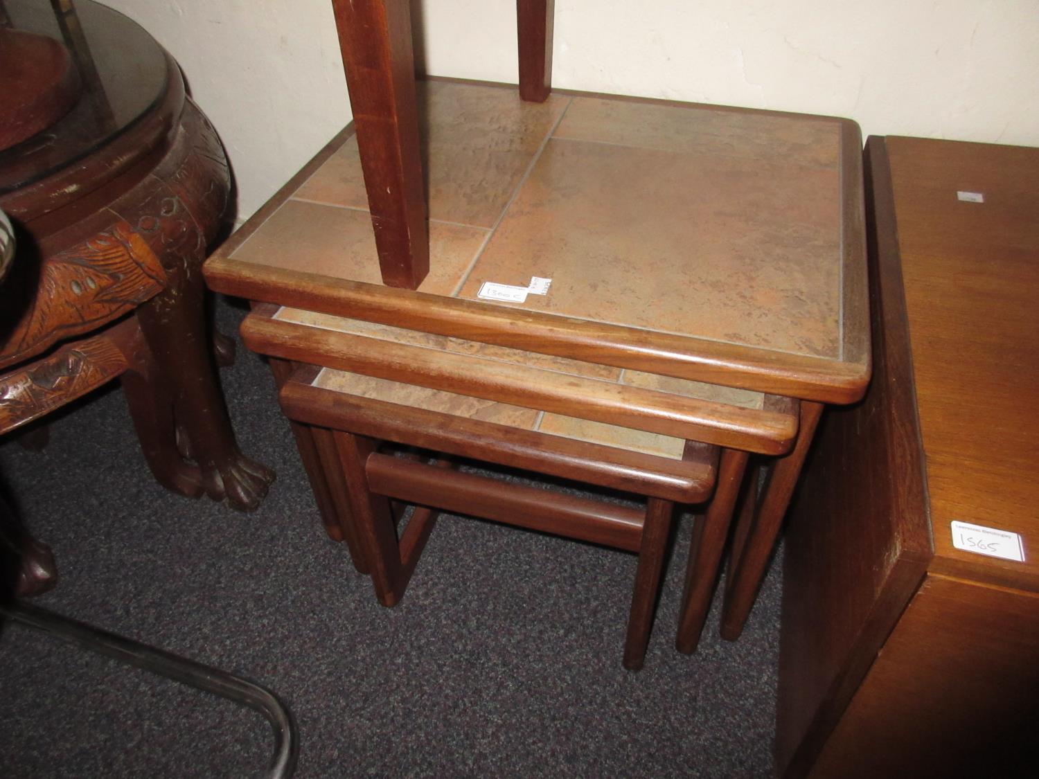 Nest of three Danish teak tile inset occasional tables