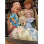 Box containing a quantity of various 20th Century plastic and composition dolls