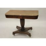George IV mahogany rosewood crossbanded fold-over card table on fluted column and quadruped base (