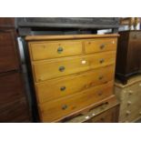 19th Century stained pine chest of two short and three long drawers with oval brass handles, on