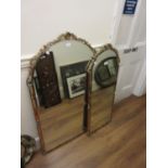 Two reproduction Venetian style arched top wall mirrors, the largest 49ins x 27ins