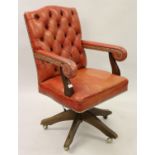 20th Century red buttoned leather upholstered and brass studded revolving office chair