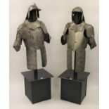 Pair of 20th Century Cromwellian style suits of armour with lobster tail helmets, mounted on an