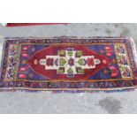 Small Turkish rug together with a small machine made Bokhara rug