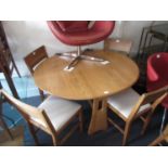 Ercol light ash drop leaf dining table together with a set of four dining chairs