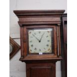 George III oak longcase clock, the square hood above a rectangular panelled door on a later plinth