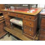 Small 19th Century walnut twin pedestal desk with a red leather inset top, above nine drawers with