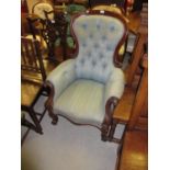 Victorian mahogany and blue button upholstered drawing room armchair with scroll shaped arms and