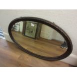 1930's Oval oak framed bevel edged wall mirror