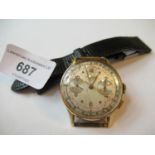 18ct gold cased Swiss chronograph wristwatch with later strap, 34mm diameter (not working)