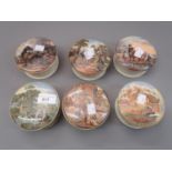 Collection of six various framed Prattware pot lids with bases