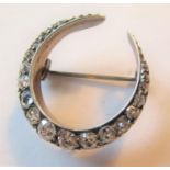 Victorian crescent brooch set graduated old cut diamonds, chip to one stone and frame work in need