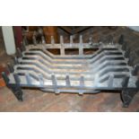 Modern cast iron fire grate with castellated surround, 23ins wide