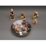 Group of four various Goebel Hummel figures together with a Hummel wall plate Chip to base on the