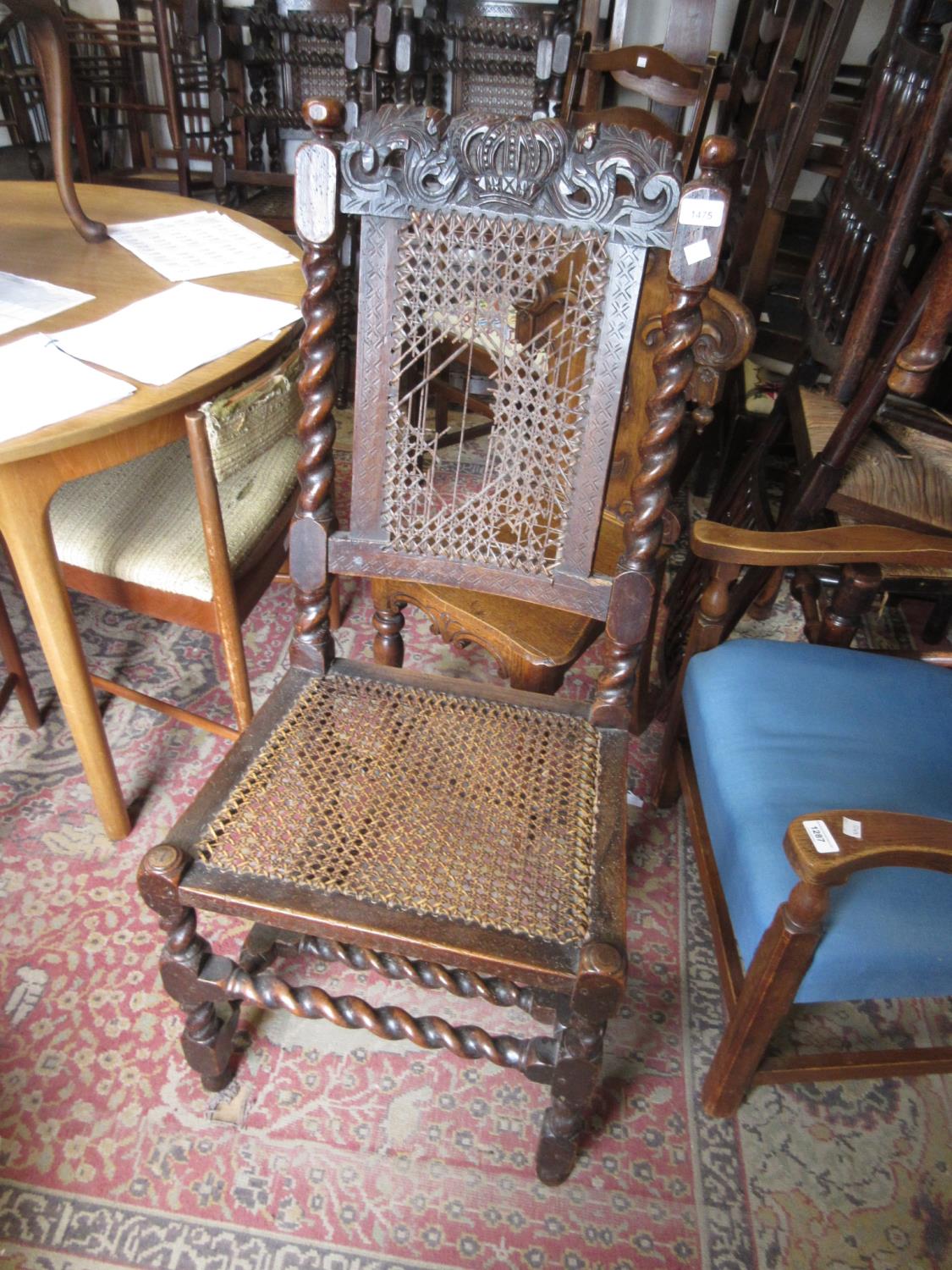 17th Century walnut side chair with carved cresting rail, cane back and seat on barley twisted