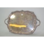 Large silver plated two handled tray with a shaped gadroon and shell pattern rim with end handles (