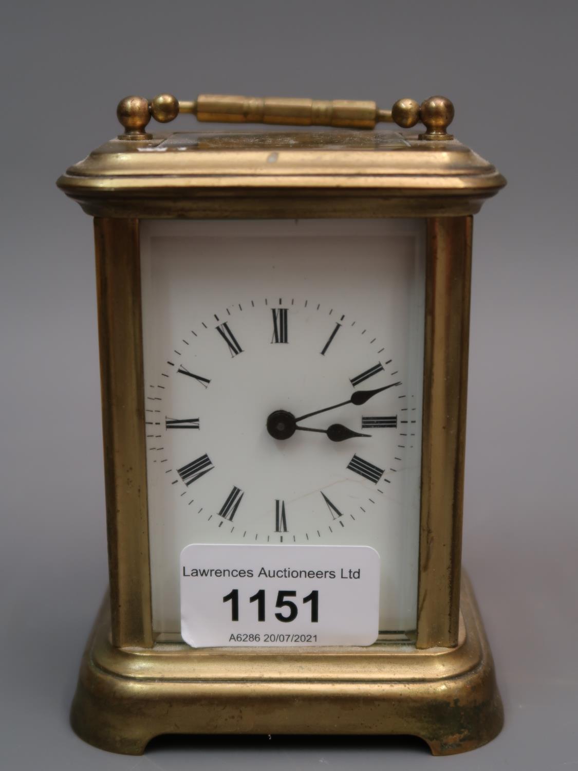 Small brass cased carriage clock, the enamel dial with Roman numerals and single train movement, 4.