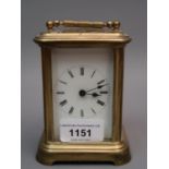 Small brass cased carriage clock, the enamel dial with Roman numerals and single train movement, 4.