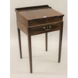 George III mahogany clerk's desk with hinged sloping top and single drawer, on square tapered