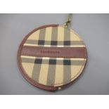 Circular Burberry purse