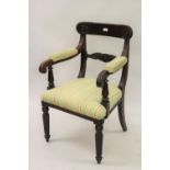 William IV mahogany open armchair, the carved and moulded rail back above moulded and padded arms,