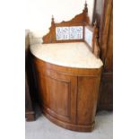 Victorian mahogany corner washstand, the shaped tiled back above a flecked marble top, plain